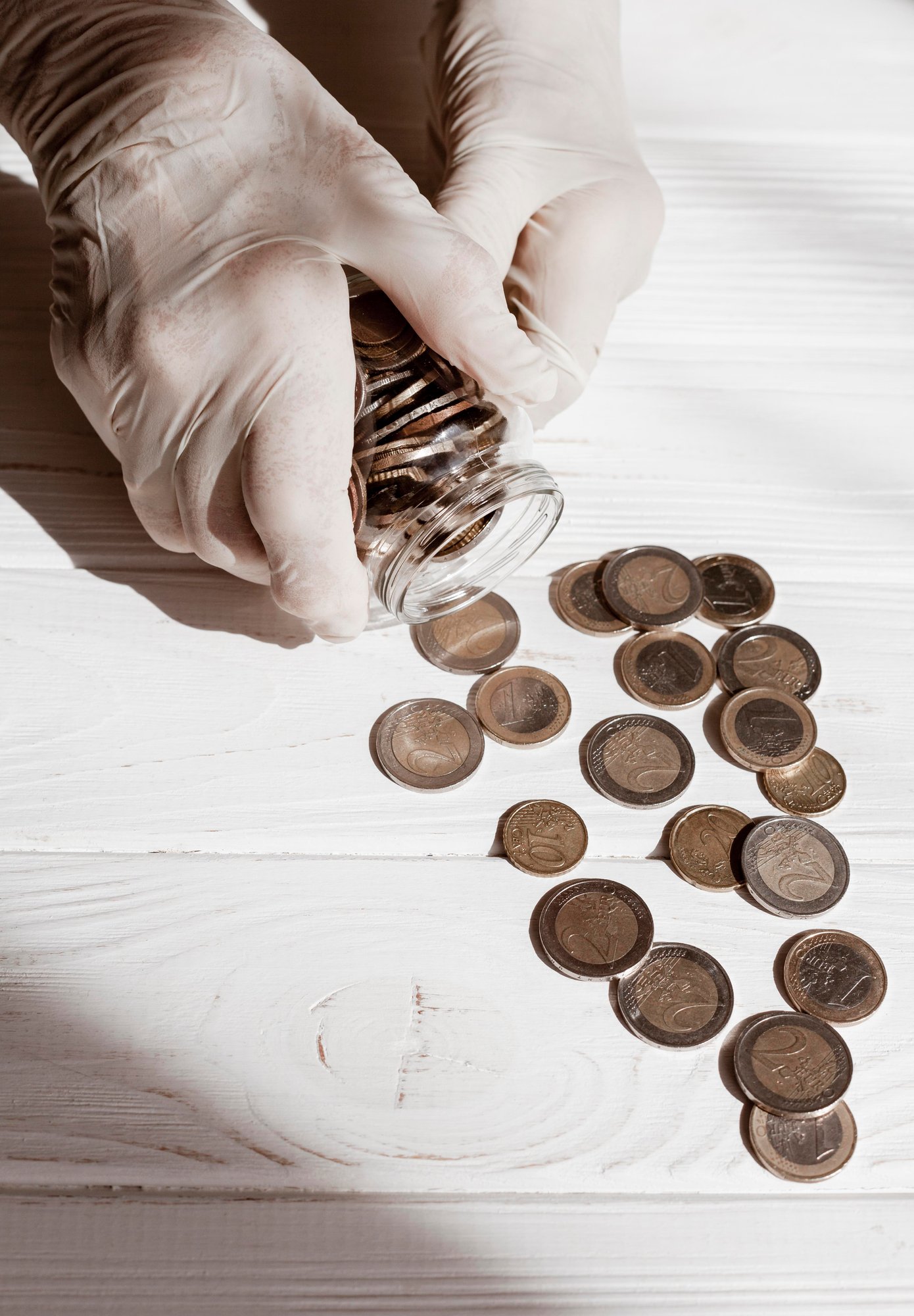 hands-wearing-protection-gloves-coins